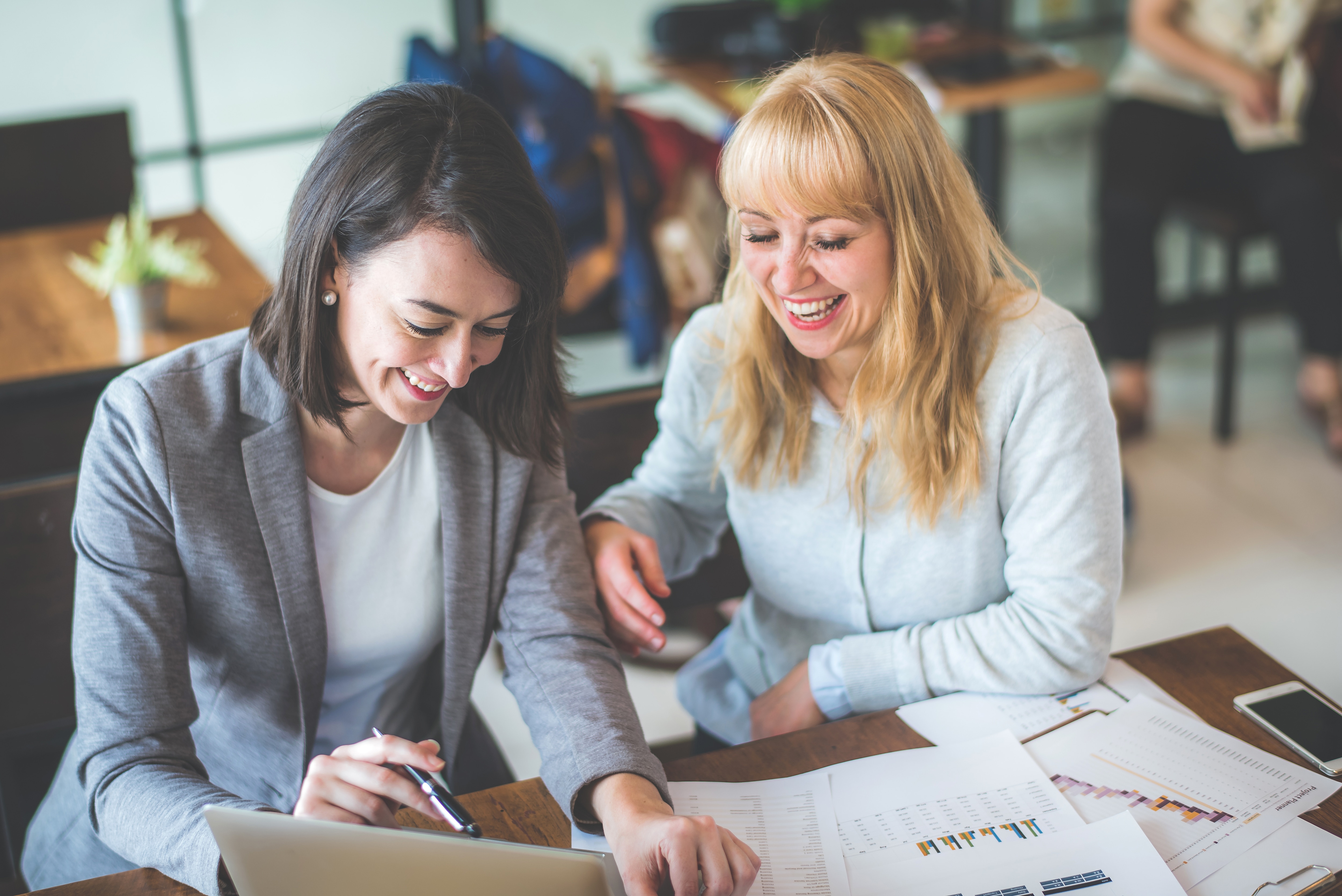 two businesswomen working together in an office