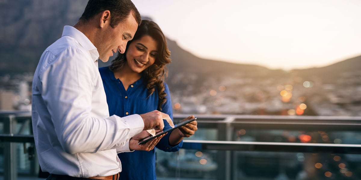 two people working on a tablet