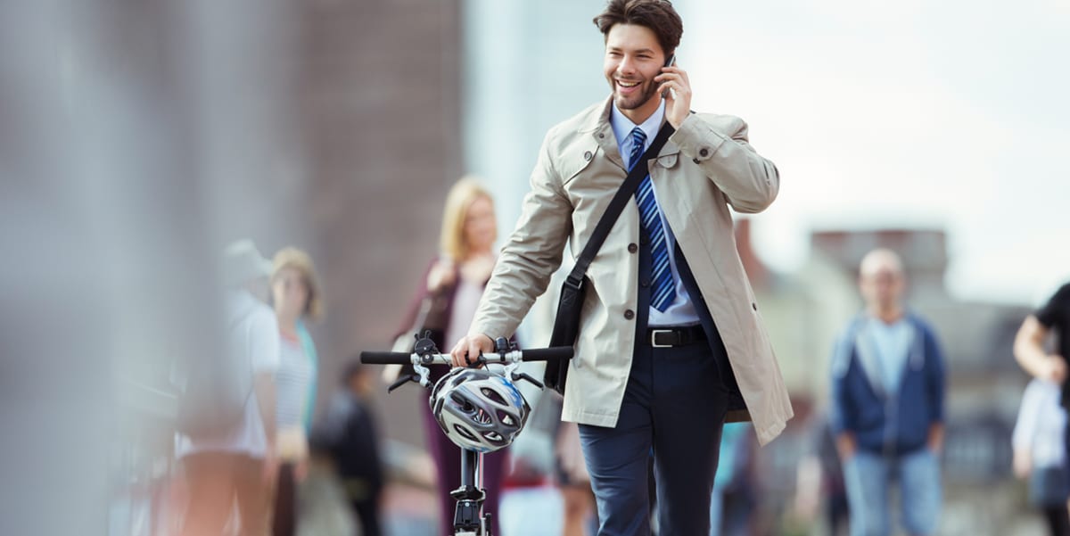 man biking to work on the phone