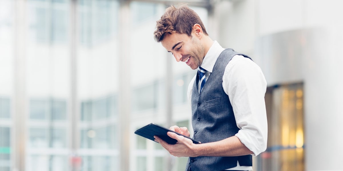 business man looking at tablet