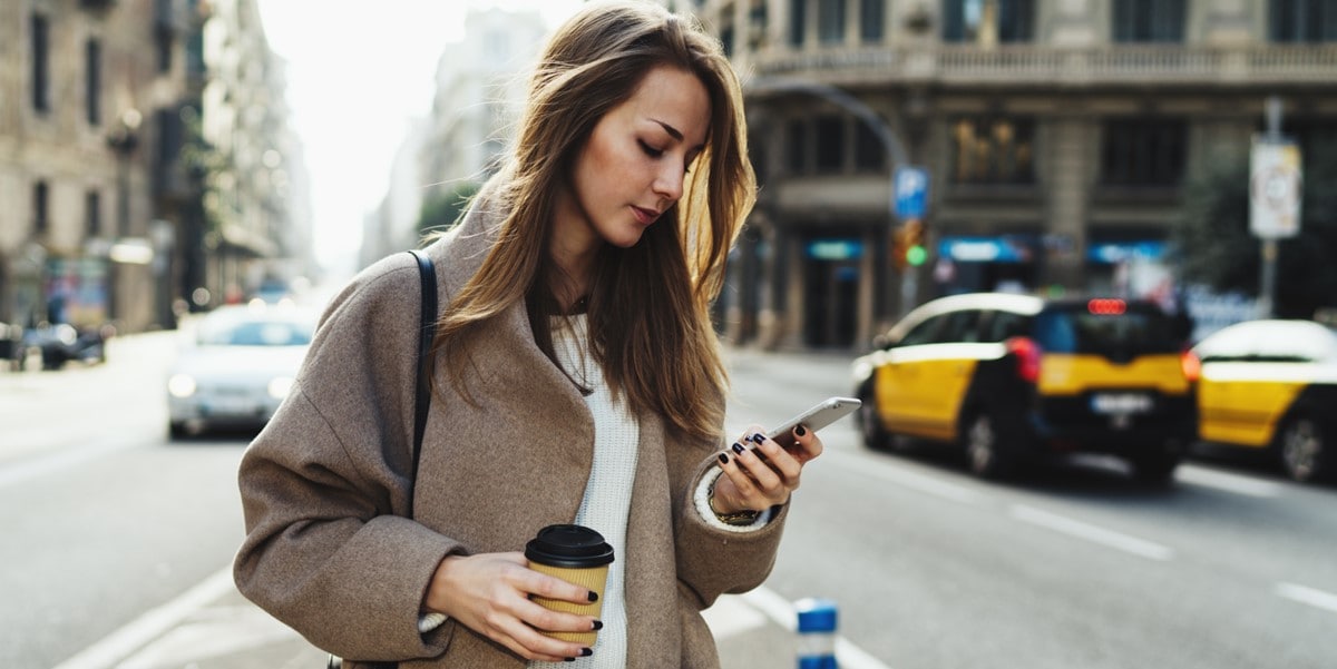 woman in city using cellphone