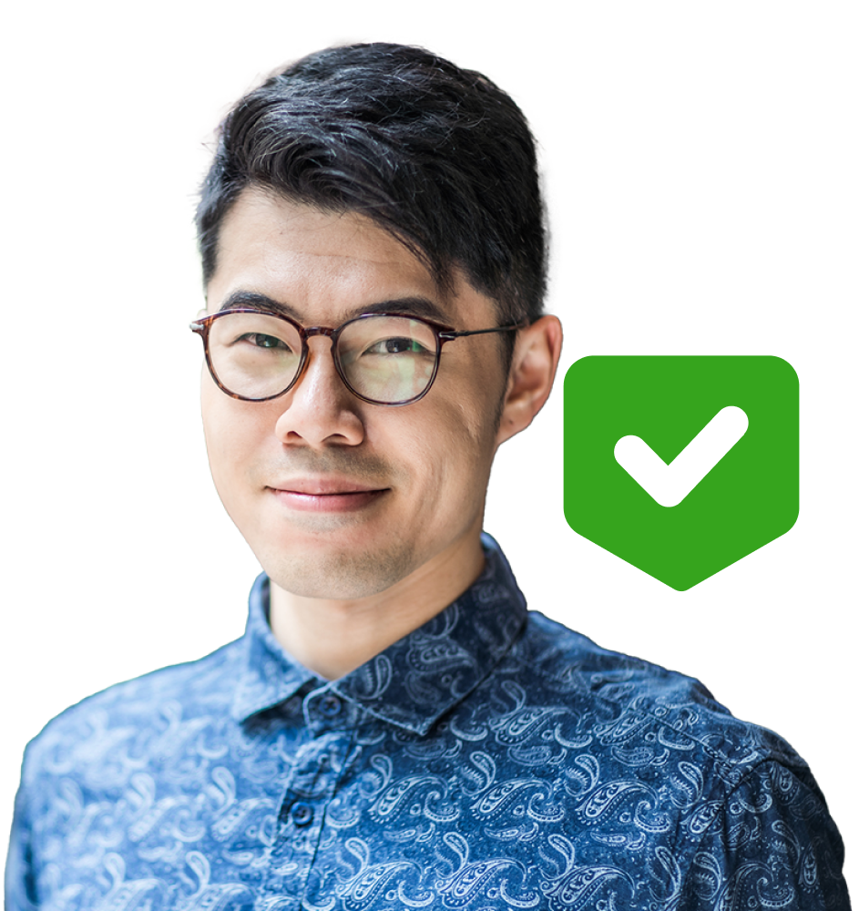 Man standing next to green checkmark