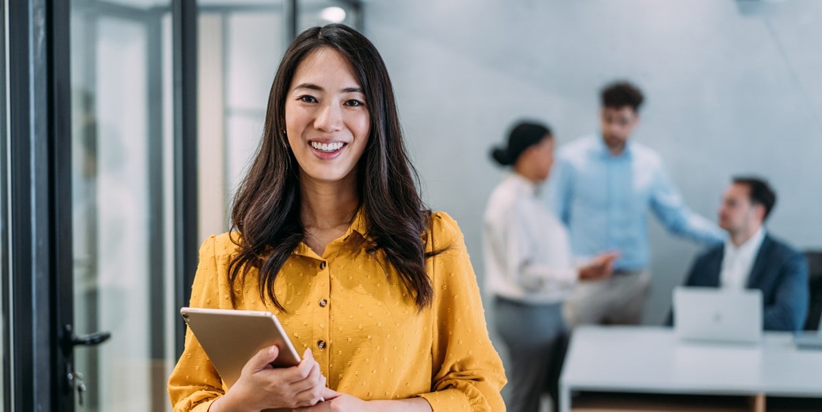 woman in the office holding a tablet