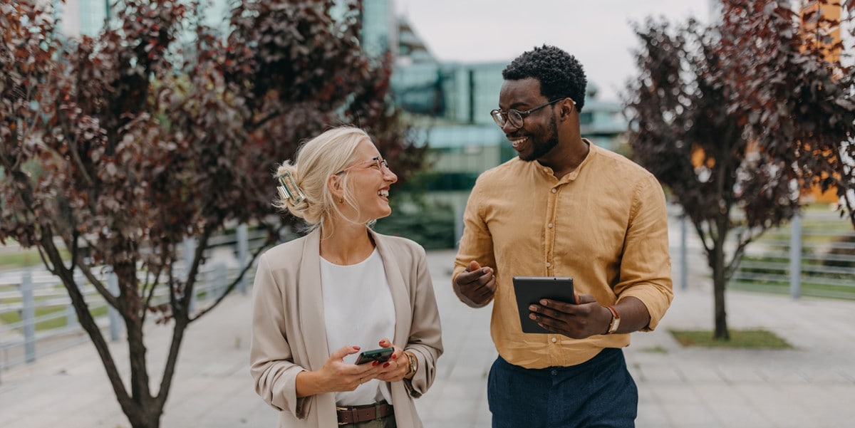 two professionals walking outside