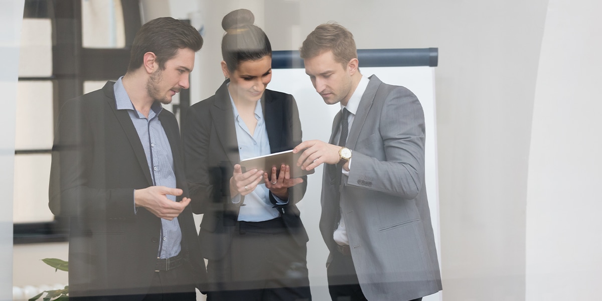 Three people in office meeting