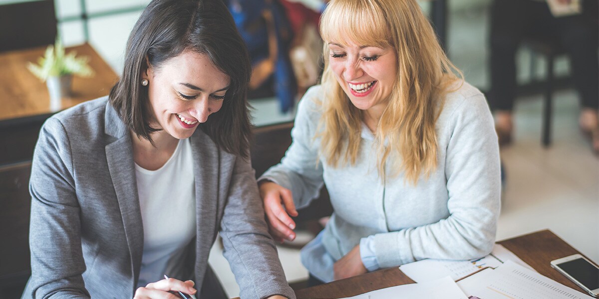 two businesswomen working together in an office