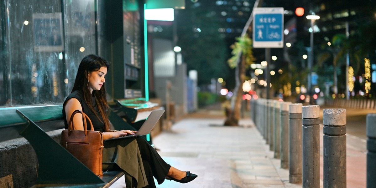 traveler sitting at a train station