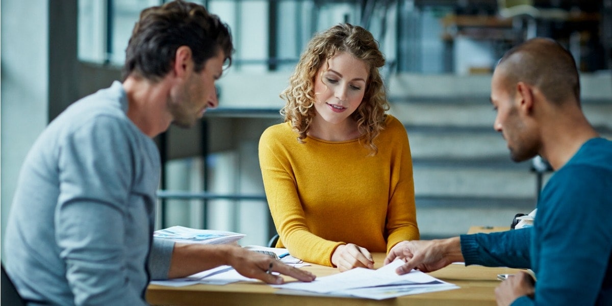 group of people working together around a table
