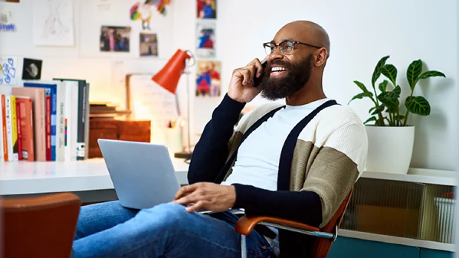 Man speaking on phone and smiling