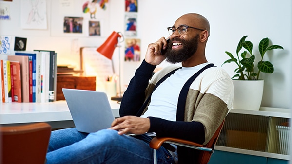 Man speaking on phone and smiling